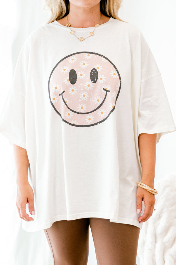 Chic Soul plus size clothing, Ivory Short sleeve graphic tee with a black smiley face in the center of the shirt that is filled with a light pink daisy pattern 