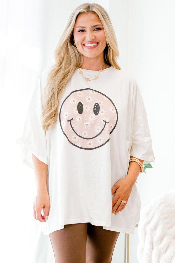 Chic Soul plus size clothing, Ivory Short sleeve graphic tee with a black smiley face in the center of the shirt that is filled with a light pink daisy pattern 