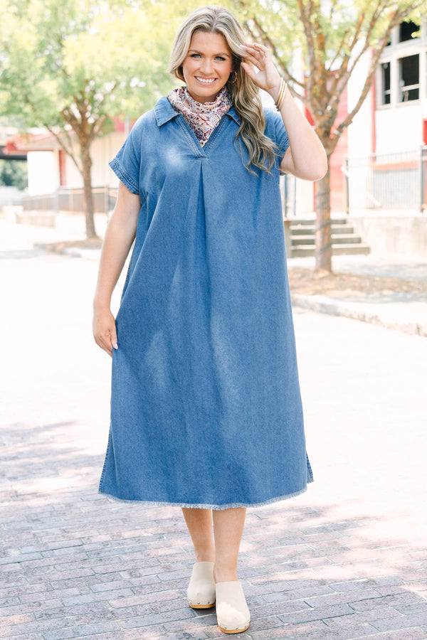Plus Size blue denim midi dress with a collared V-neckline, short sleeves, and a frayed hem.