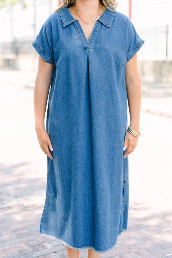 Plus Size blue denim midi dress with a collared V-neckline, short sleeves, and a frayed hem.