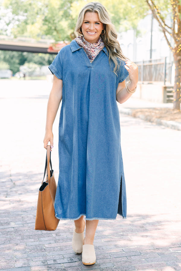Plus Size blue denim midi dress with a collared V-neckline, short sleeves, and a frayed hem.