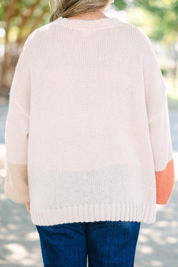 Plus size colorblock knit cardigan in multi-color peach, tan, and cream with a relaxed, flowy fit.