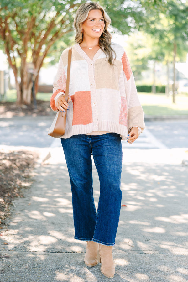 Plus size colorblock knit cardigan in multi-color peach, tan, and cream with a relaxed, flowy fit.