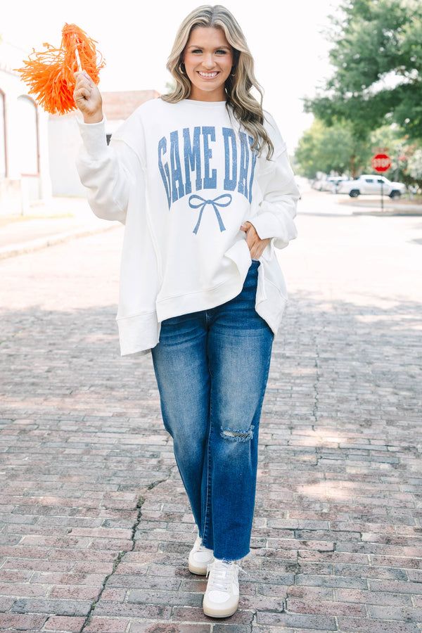 Plus Size ivory crew neck sweatshirt with blue 'GAME DAY' text and a bow graphic