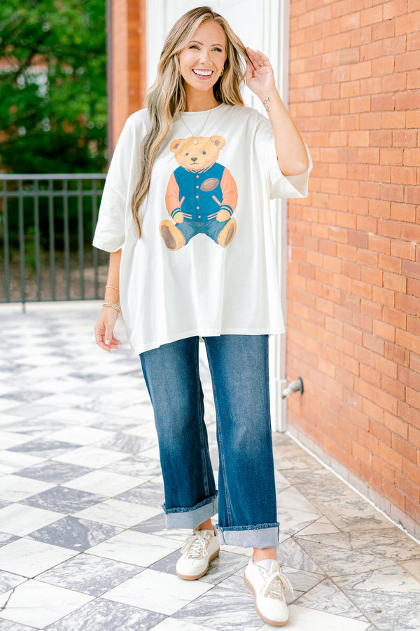Chic Soul plus size clothing, white short sleeve boyfriend tee with a teddy bear on the center of the shirt that has on a football letterman jacket 