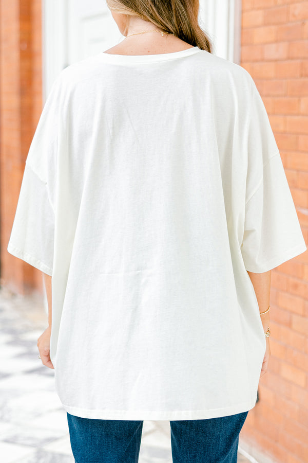 Chic Soul plus size clothing, white short sleeve boyfriend tee with a teddy bear on the center of the shirt that has on a football letterman jacket 