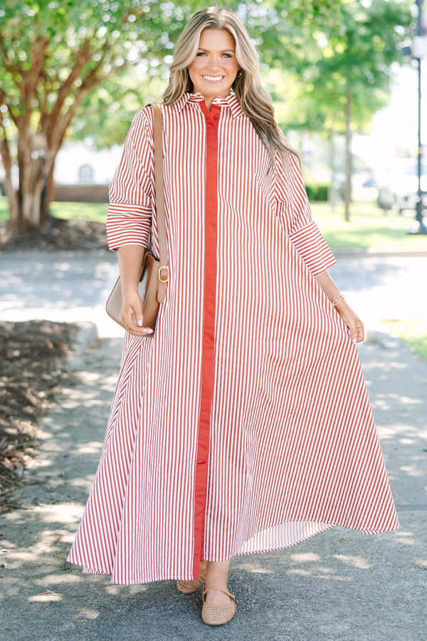 Plus size red and white striped maxi dress with a flowy fit, button-down front, and wide sleeves.