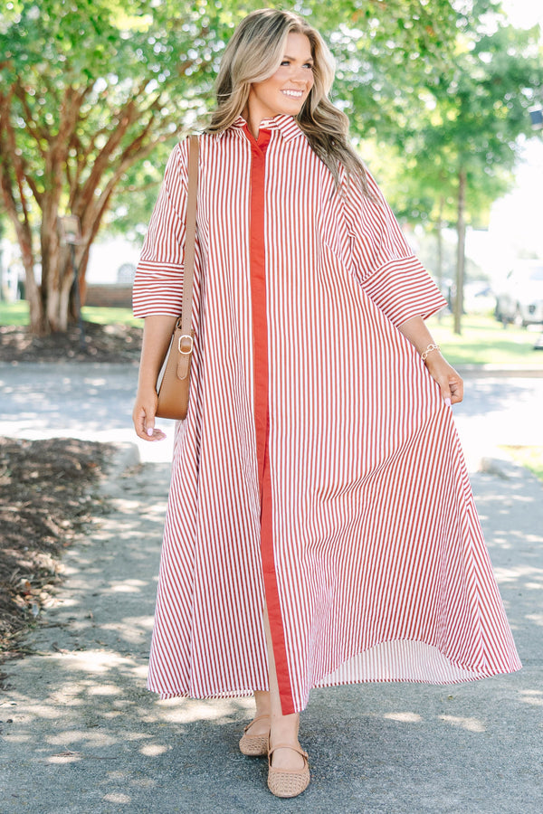Plus size red and white striped maxi dress with a flowy fit, button-down front, and wide sleeves.