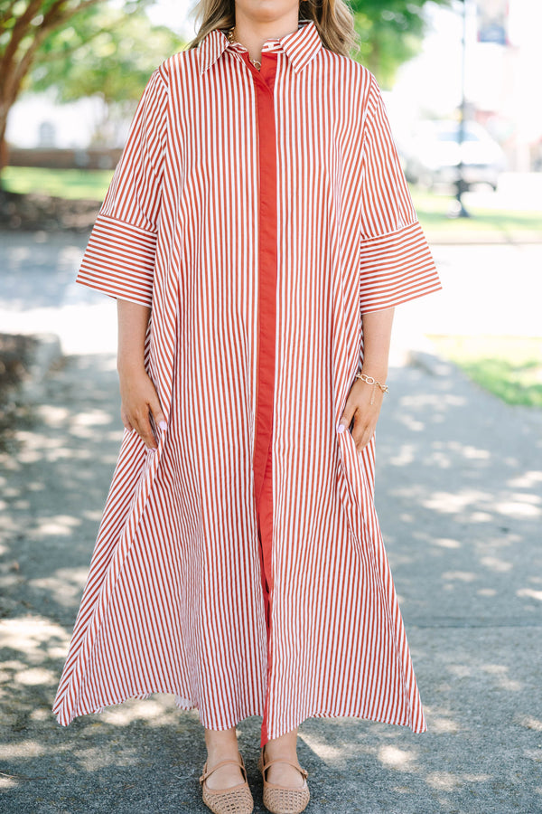 Plus size red and white striped maxi dress with a flowy fit, button-down front, and wide sleeves.