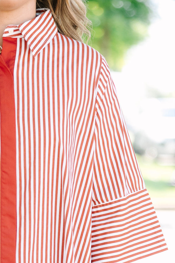 Plus size red and white striped maxi dress with a flowy fit, button-down front, and wide sleeves.