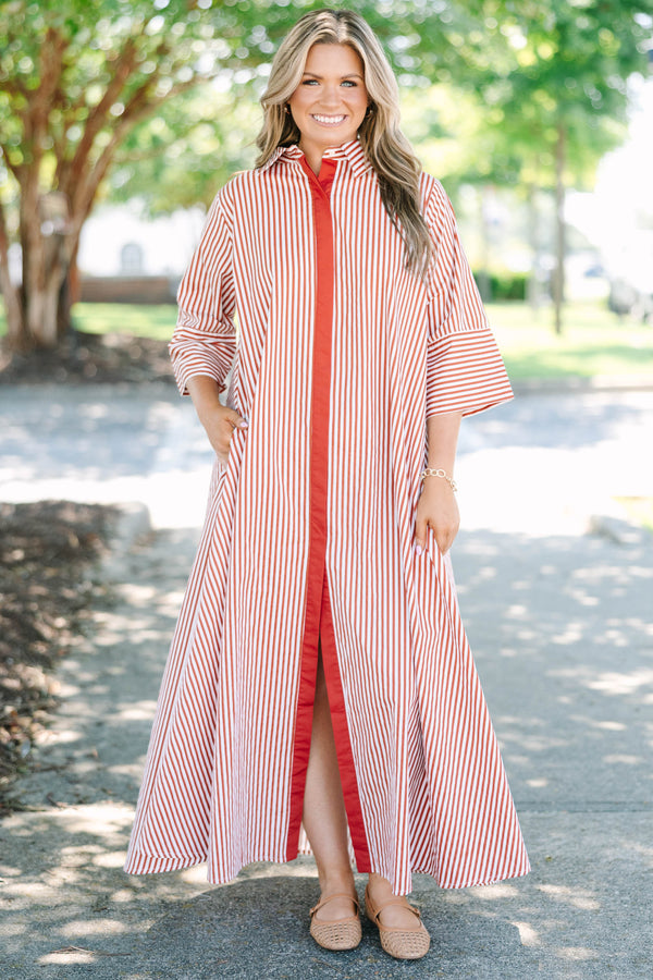 Plus size red and white striped maxi dress with a flowy fit, button-down front, and wide sleeves.