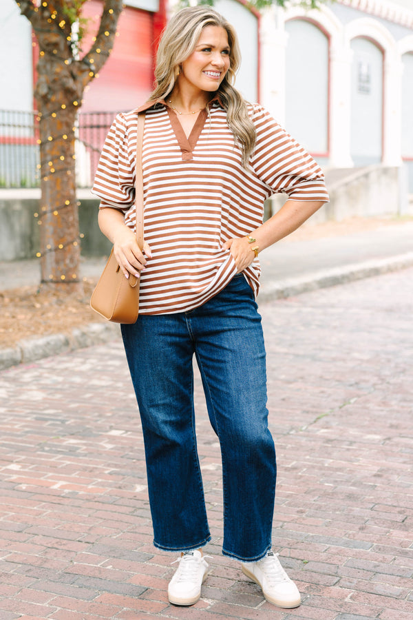 Plus Size brown and white striped popover top with a v-neck collar and short puff sleeves.