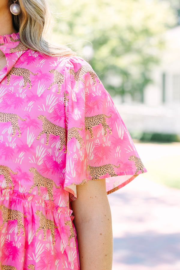 Plus Size fuchsia tiered midi dress with a leopard and palm print, v-neckline, and flutter sleeves.