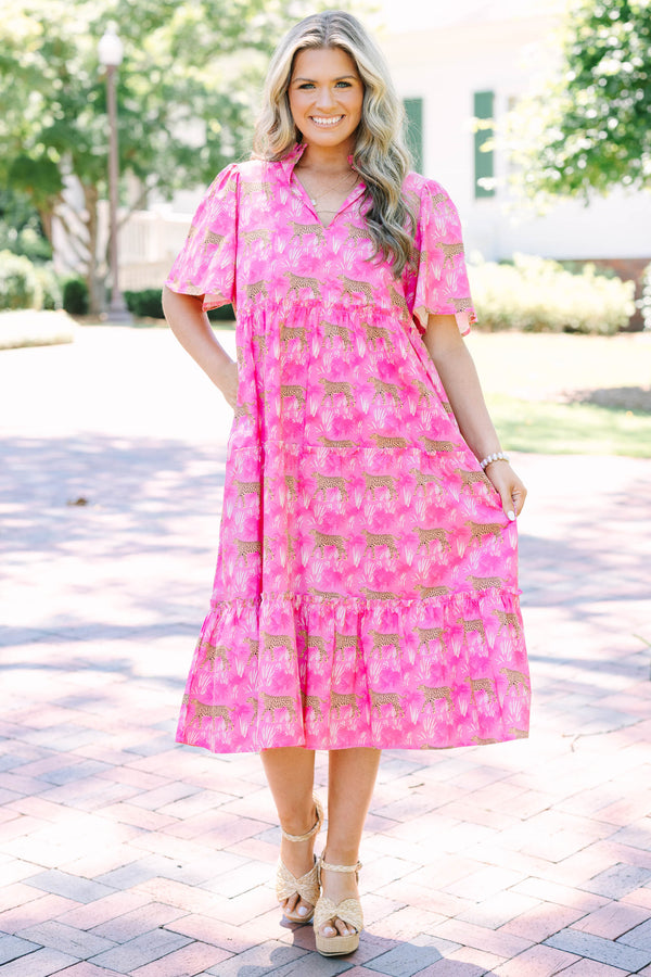 Plus Size fuchsia tiered midi dress with a leopard and palm print, v-neckline, and flutter sleeves.