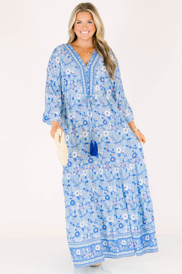 Plus Size blue floral maxi dress with long sleeves, a V-neckline, and tassel drawstring waist.