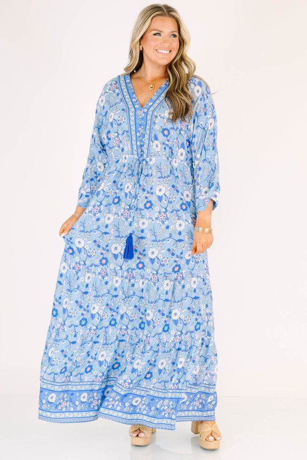 Plus Size blue floral maxi dress with long sleeves, a V-neckline, and tassel drawstring waist.