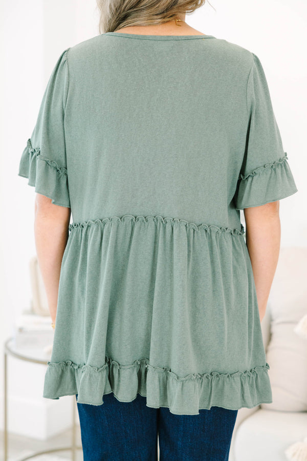 Plus size dusty green babydoll top with ruffle sleeves and hemline
