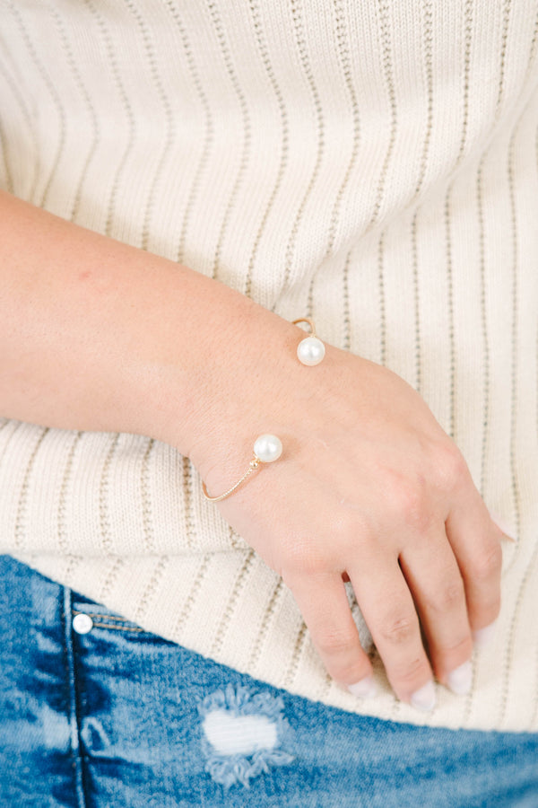Gold-tone Gilded Pearl Bracelet with two white pearls on an open cuff design.