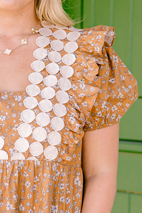 Chic Soul plus size clothing, brown top with bubble sleeves and a floral pattern with a textured circle design going down to the chest