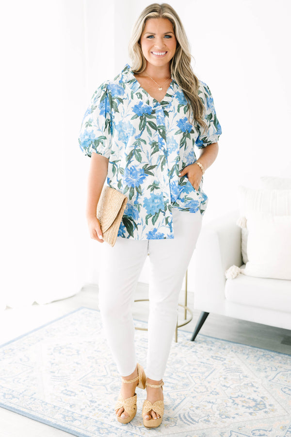 Plus Size ivory button-up top with blue floral print, ruffled collar, and puff sleeves.