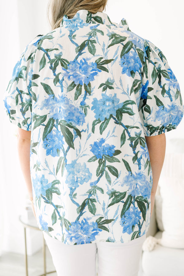 Plus Size ivory button-up top with blue floral print, ruffled collar, and puff sleeves.