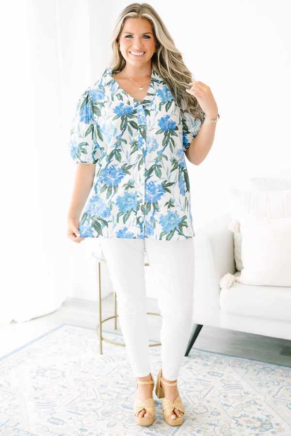 Plus Size ivory button-up top with blue floral print, ruffled collar, and puff sleeves.