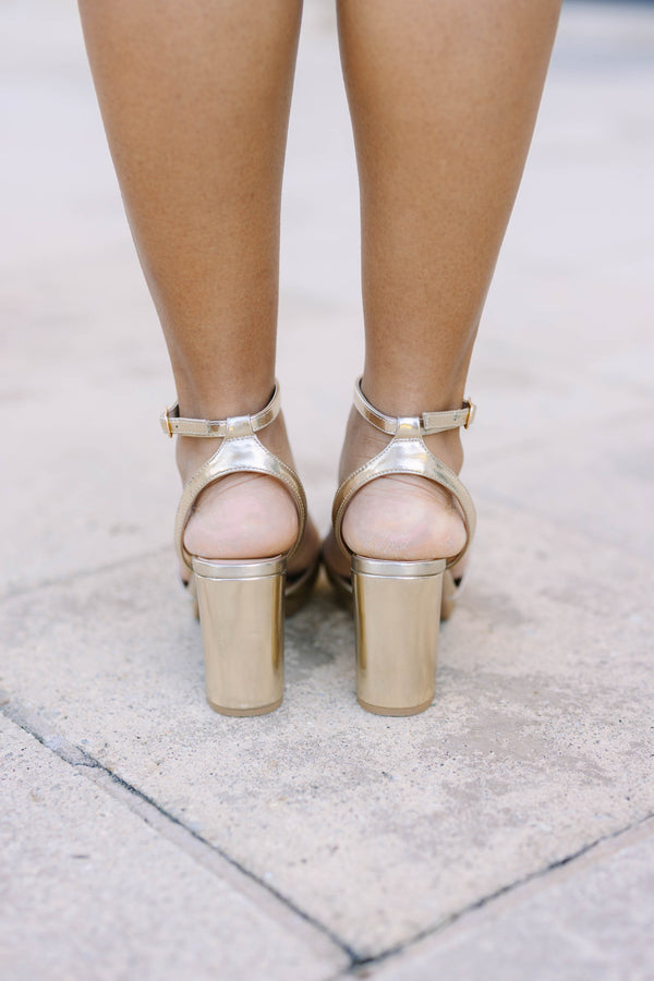 Plus Size gold metallic block heels with a platform sole and adjustable ankle strap.