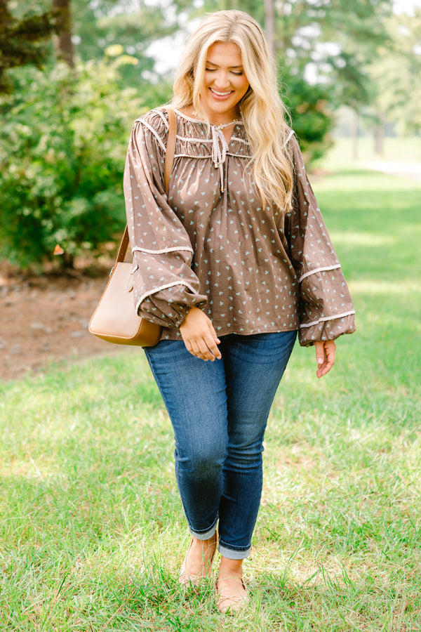 Chic Soul plus size clothing, brown top with long bubble sleeves and a baby blue bow pattern throughout with white stitching details on chest and sleeves 