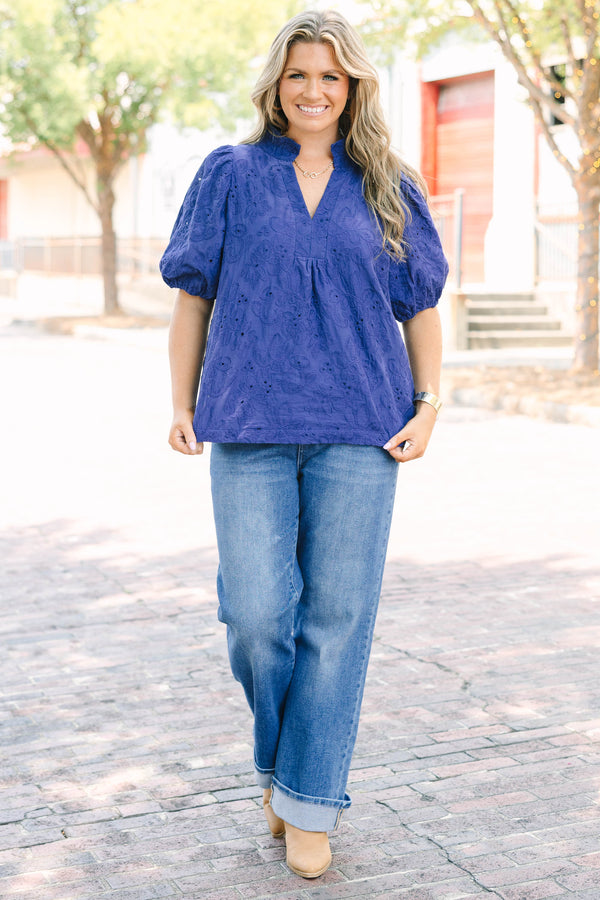 Plus Size medium wash straight leg jeans with front patch pockets and cuffed hems.