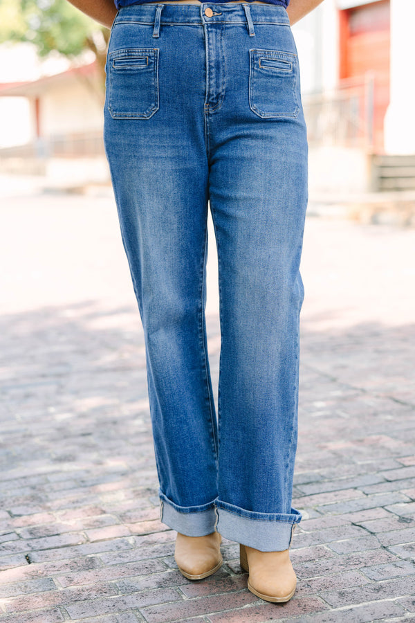 Plus Size medium wash straight leg jeans with front patch pockets and cuffed hems.