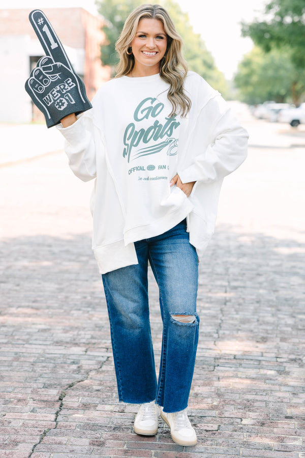Plus Size ivory crew neck sweatshirt with a green Go Sports graphic and relaxed, oversized fit.