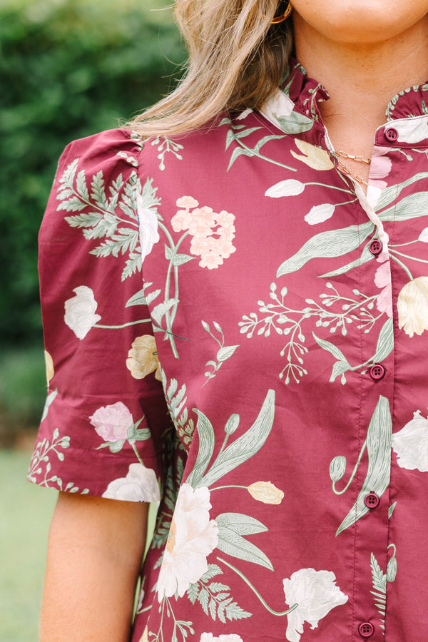Plus Size burgundy floral button-down top with puff short sleeves and a high collar.