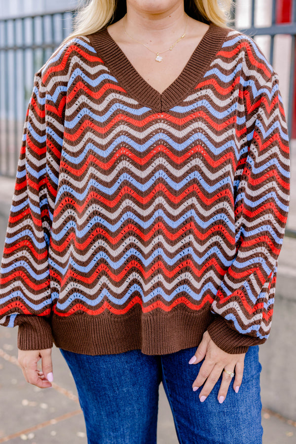 Chic Soul plus size clothing, brown-multi long sleeve sweater with a brown red and blue wavy pattern  and a slight v-neckline