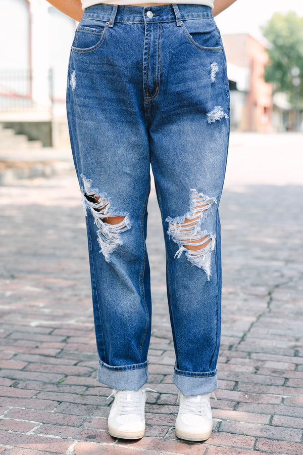 Plus Size dark wash high-rise jeans with heavy distressing
