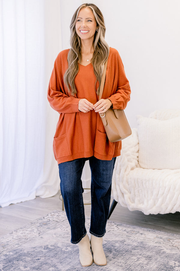 Chic Soul plus size clothing, copper orange long sleeve v neck tunic sweater with 2 front lower pockets
