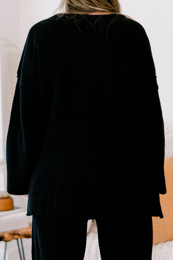 Chic Soul Plus size Clothing, black set with pants and a long sleeve top that have a waffle knit texture and the the top has buttons going down to the chest 