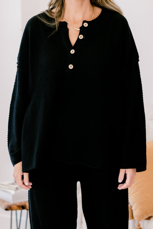 Chic Soul Plus size Clothing, black set with pants and a long sleeve top that have a waffle knit texture and the the top has buttons going down to the chest 