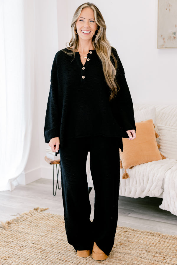 Chic Soul Plus size Clothing, black set with pants and a long sleeve top that have a waffle knit texture and the the top has buttons going down to the chest 