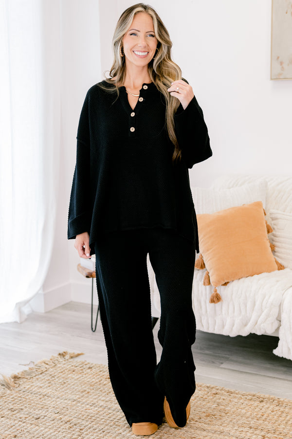 Chic Soul Plus size Clothing, black set with pants and a long sleeve top that have a waffle knit texture and the the top has buttons going down to the chest 