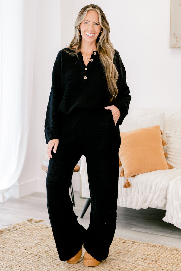 Chic Soul Plus size Clothing, black set with pants and a long sleeve top that have a waffle knit texture and the the top has buttons going down to the chest 