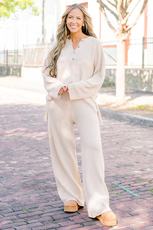 Chic Soul Plus size Clothing, cream set with pants and a long sleeve top that have a waffle knit texture and the the top has buttons going down to the chest 