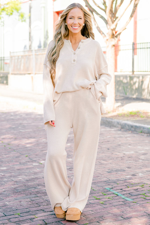 Chic Soul Plus size Clothing, cream set with pants and a long sleeve top that have a waffle knit texture and the the top has buttons going down to the chest 