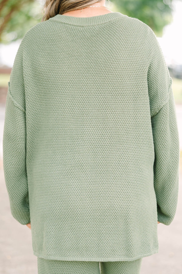 Plus size olive green knit set with a button-down henley top and matching shorts in a relaxed fit.