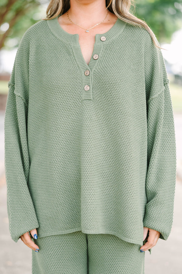 Plus size olive green knit set with a button-down henley top and matching shorts in a relaxed fit.