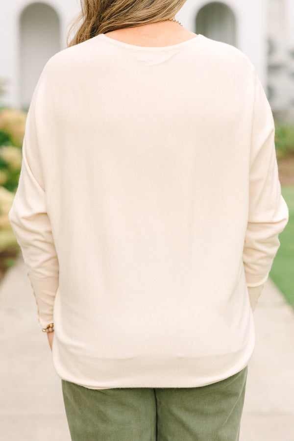 Plus Size beige relaxed fit knit sweater with a round neckline and button-cuffed long sleeves.