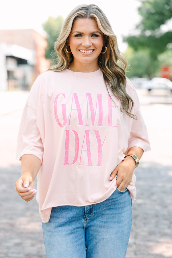 Plus Size vintage wash blush pink t-shirt with pink GAME DAY text, crew neck, and unfinished hem.