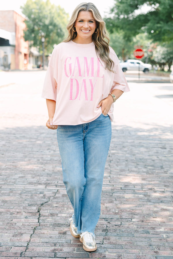 Plus Size vintage wash blush pink t-shirt with pink GAME DAY text, crew neck, and unfinished hem.