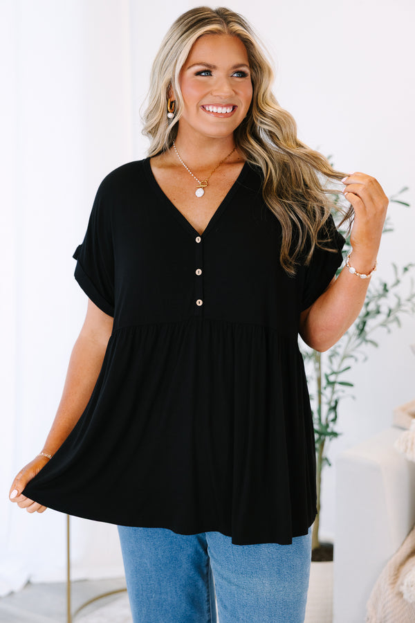 Plus Size black babydoll top with a V-neckline, decorative buttons, and cuffed short sleeves.