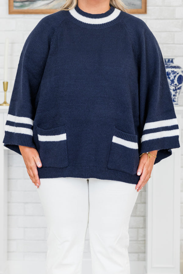 Chic Soul plus size clothing, long-sleeve navy blue knit top with a mock-neckline and a color block white striped pattern along the sleeves and neckline with two pockets along the bottom of the top
