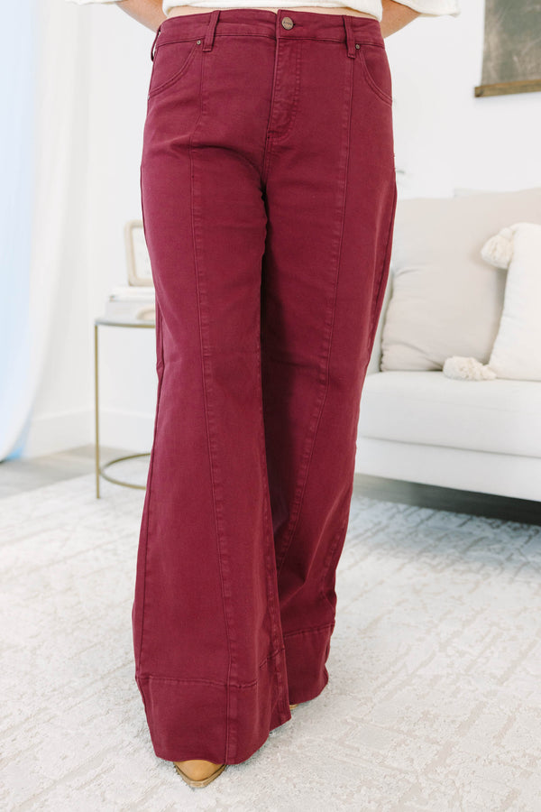 Plus size wine-colored wide leg pants in a stretchy cotton blend with a flattering high-waist fit.